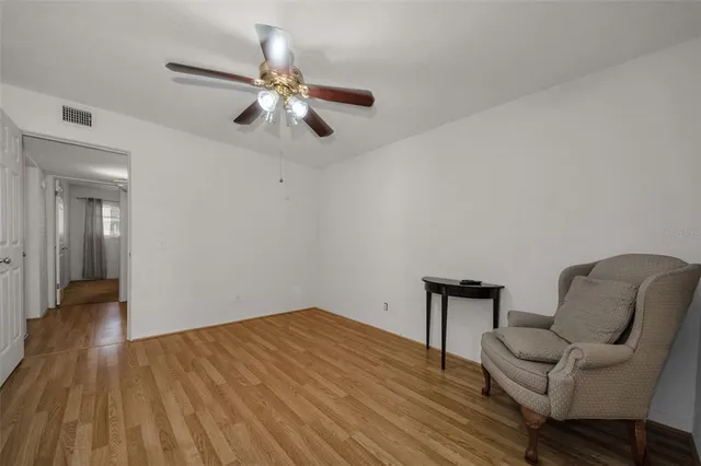 a view of a swimming pool with an outdoor seating