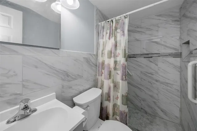 a view of a swimming pool with an outdoor seating and trees