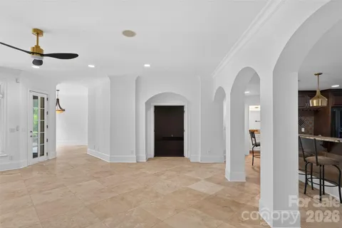 a view of a hallway with wooden floor and entryway