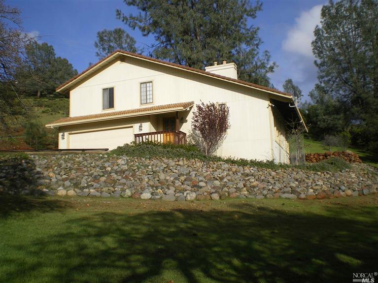 16128 Eagle Rock Road Hidden Valley Lake, CA 95467 - Photo 1 of 1 a front view of house with garden