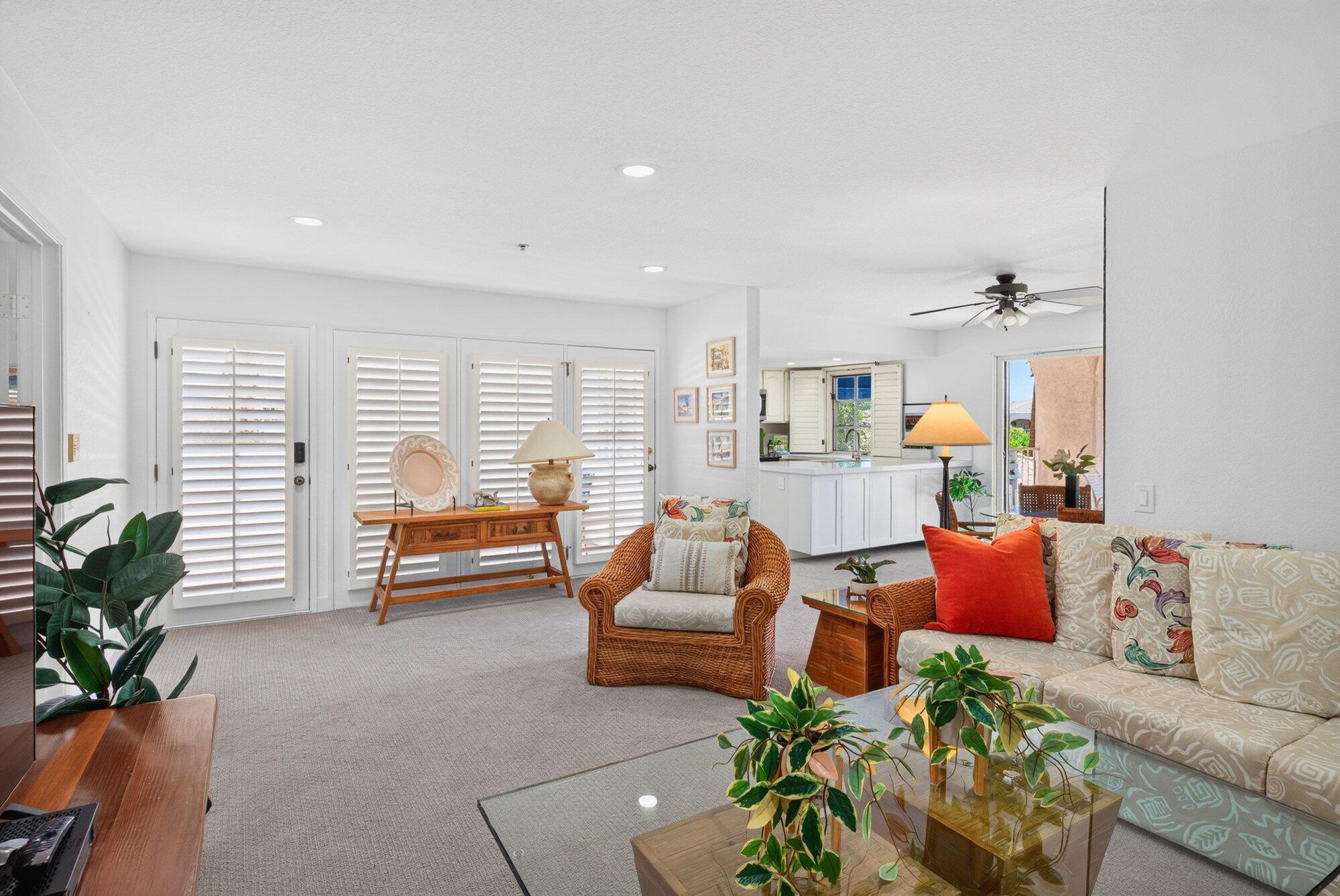 500 East Amado Road, Unit 313 Palm Springs, CA 92262 - Photo 7 of 32 a living room with furniture and a large window