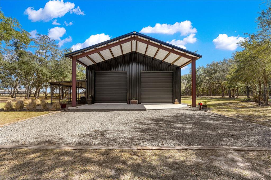 4120 Southwest 199th Court Dunnellon, FL 34431 - Photo 14 of 82 a front view of a house with a yard