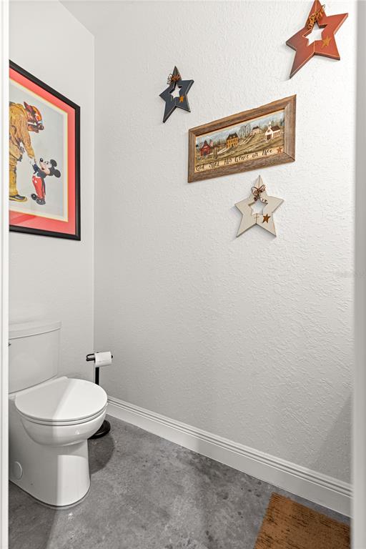 4120 Southwest 199th Court Dunnellon, FL 34431 - Photo 25 of 82 a white toilet sitting next to a bathroom sink