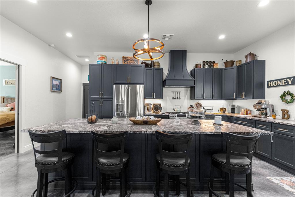 4120 Southwest 199th Court Dunnellon, FL 34431 - Photo 28 of 82 a kitchen with stainless steel appliances granite countertop a sink a stove a dining table and chairs