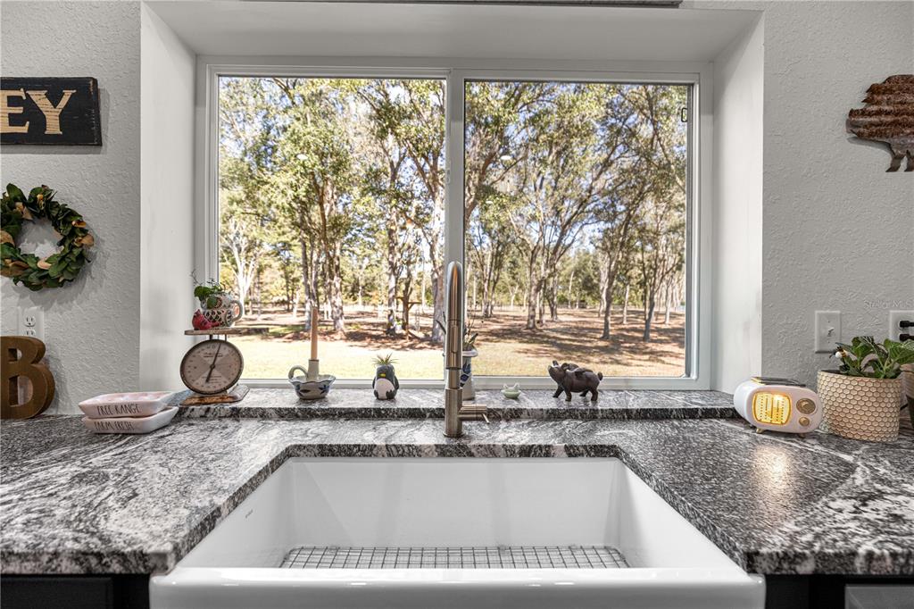 4120 Southwest 199th Court Dunnellon, FL 34431 - Photo 29 of 82 a kitchen with a sink and a large window