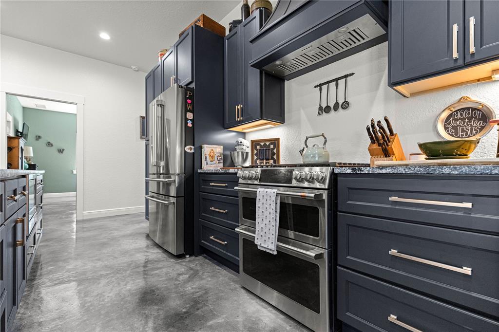 4120 Southwest 199th Court Dunnellon, FL 34431 - Photo 34 of 82 a kitchen with stainless steel appliances granite countertop a stove and a refrigerator