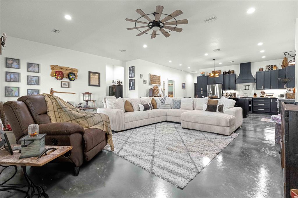 4120 Southwest 199th Court Dunnellon, FL 34431 - Photo 40 of 82 a living room with furniture and a view of kitchen