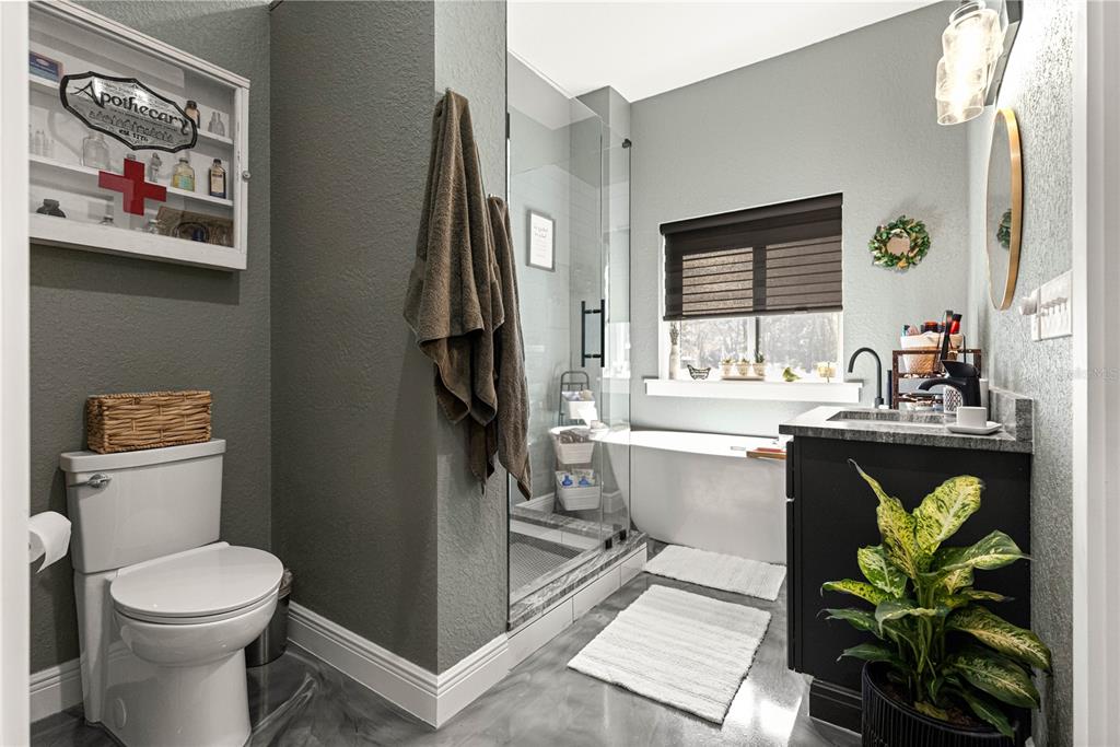 4120 Southwest 199th Court Dunnellon, FL 34431 - Photo 44 of 82 a bathroom with a sink a toilet and a window