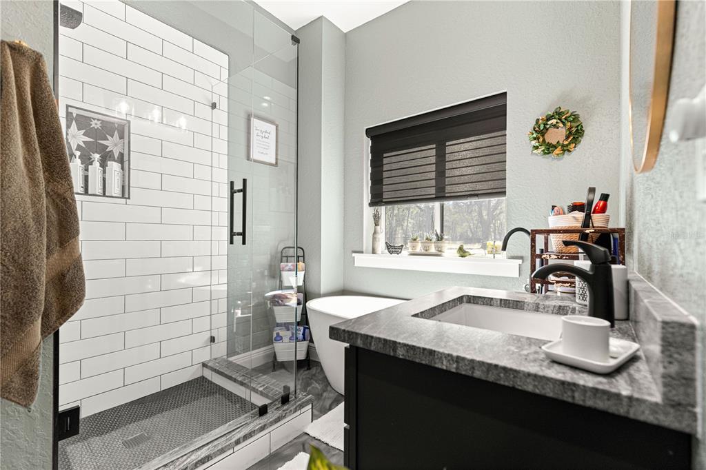 4120 Southwest 199th Court Dunnellon, FL 34431 - Photo 45 of 82 a bathroom with a sink a toilet and shower