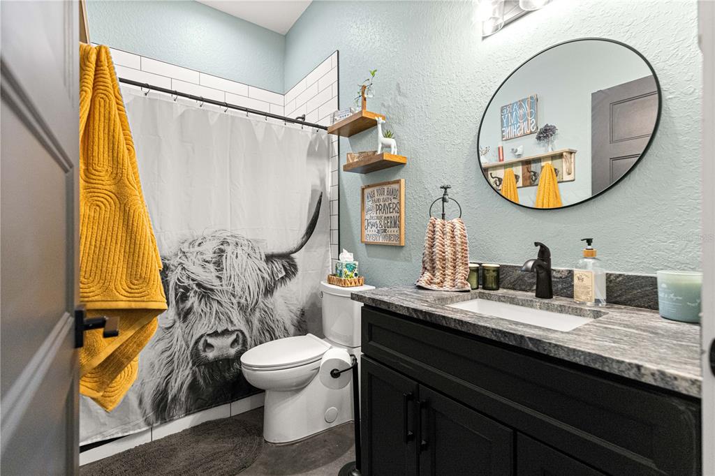 4120 Southwest 199th Court Dunnellon, FL 34431 - Photo 51 of 82 a bathroom with a sink and a mirror