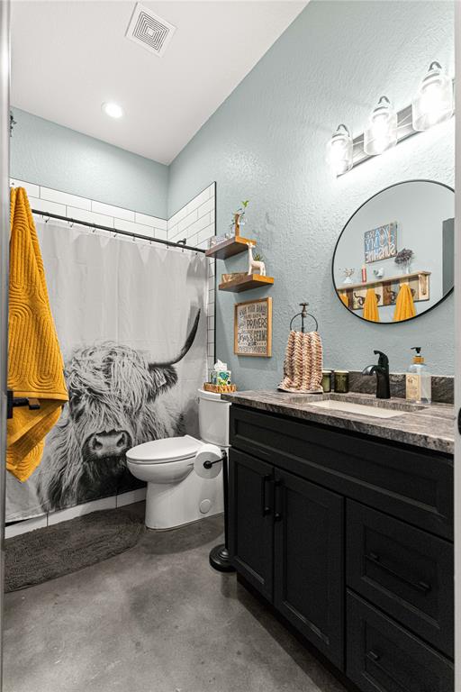 4120 Southwest 199th Court Dunnellon, FL 34431 - Photo 52 of 82 a bathroom with a toilet a sink and a mirror