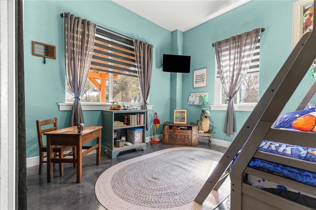 4120 Southwest 199th Court Dunnellon, FL 34431 - Photo 54 of 82 a living room with furniture and a flat screen tv