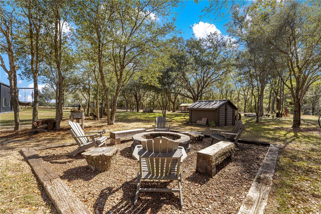 4120 Southwest 199th Court Dunnellon, FL 34431 - Photo 61 of 82 a view of a backyard with sitting area