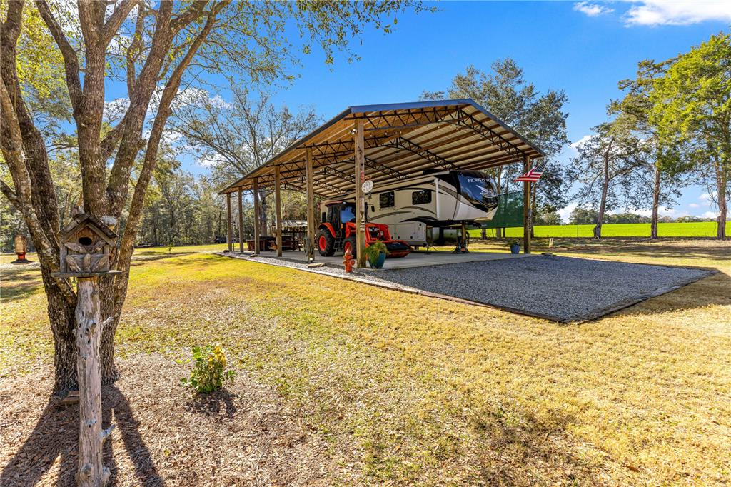 4120 Southwest 199th Court Dunnellon, FL 34431 - Photo 62 of 82 a view of swimming pool with sitting area and garden