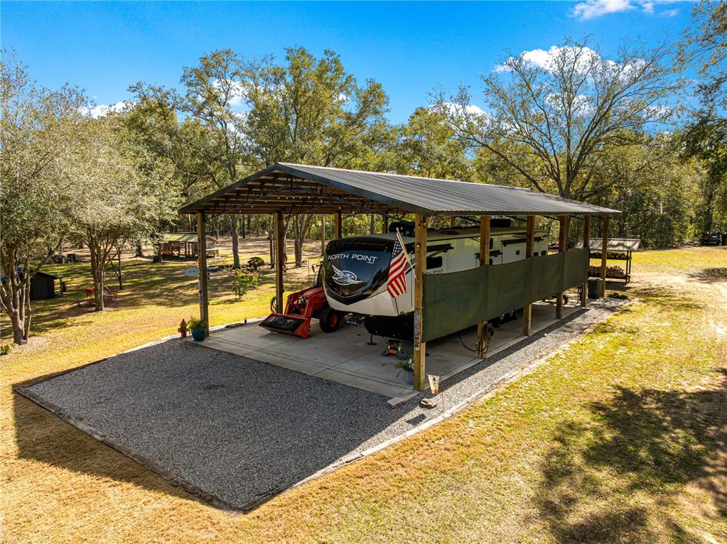 4120 Southwest 199th Court Dunnellon, FL 34431 - Photo 63 of 82 a view of a small deck with a backyard