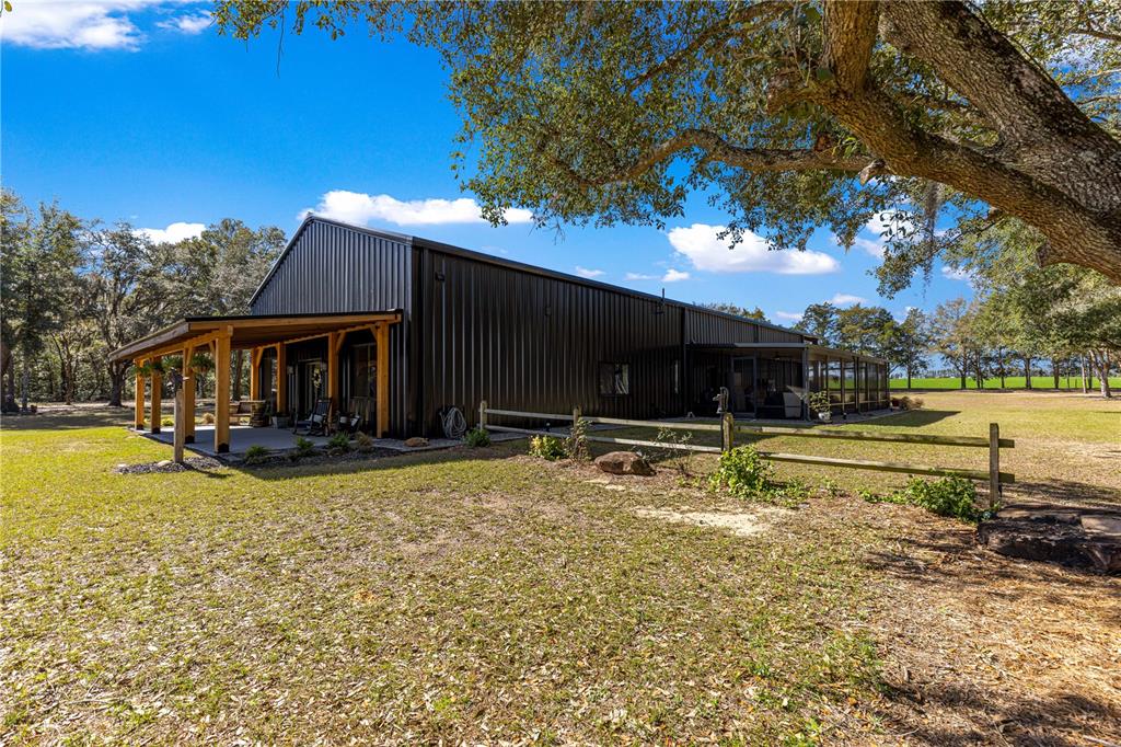 4120 Southwest 199th Court Dunnellon, FL 34431 - Photo 9 of 82 a view of a house with swimming pool and sitting area