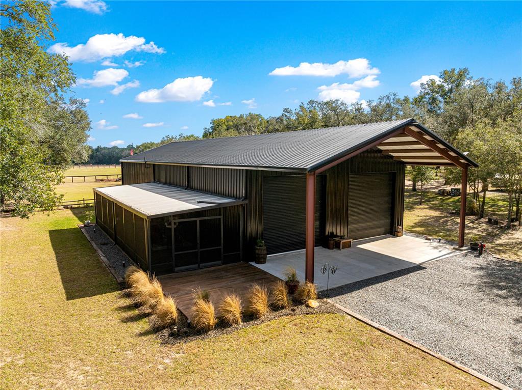 4120 Southwest 199th Court Dunnellon, FL 34431 - Photo 10 of 82 a bathroom with a sink and a mirror