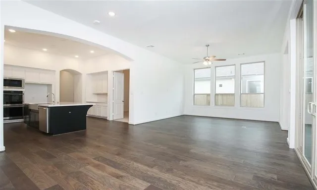 a view of kitchen with wooden floor and window