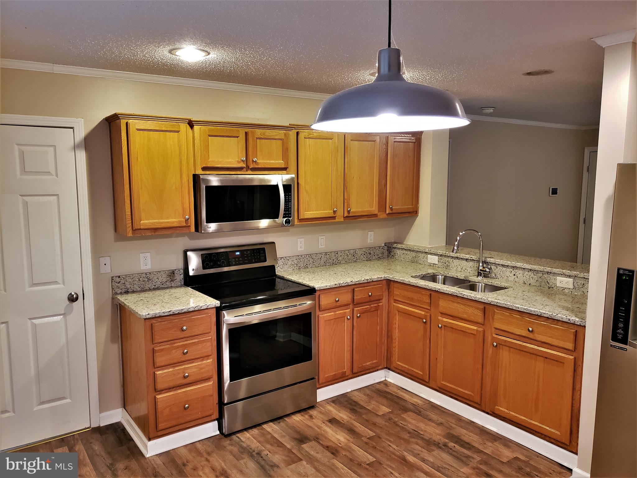 7515 Tate Road Ruther Glen, VA 22546 - Photo 14 of 28 It boasts recessed lighting for easier meal prep