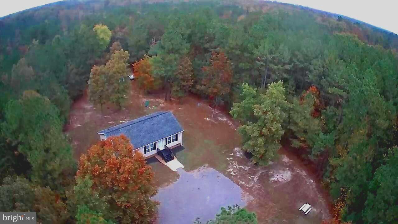 7515 Tate Road Ruther Glen, VA 22546 - Photo 27 of 28 Home is tucked amongst beautiful hardwood trees