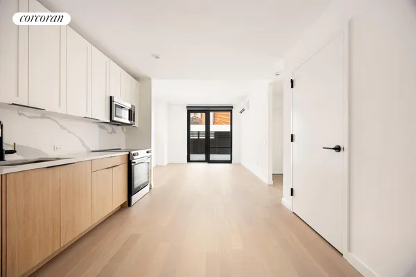 a balcony with furniture and view of city