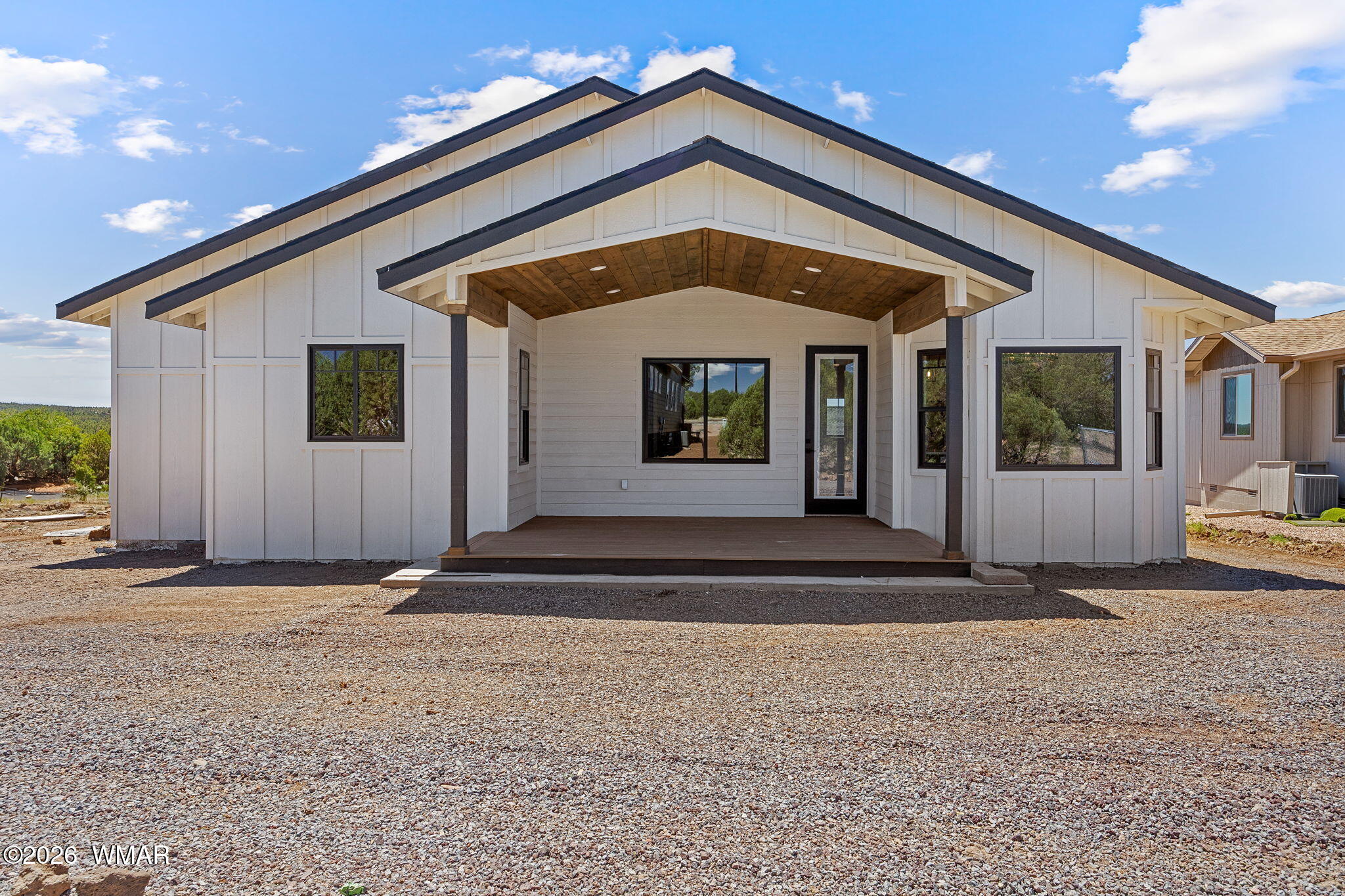 561 South Rock Ridge Drive Show Low, AZ 85901 - Photo 22 of 28 a view of a house with a porch