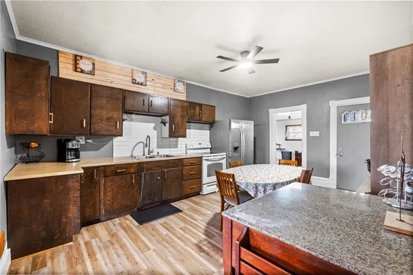 a large kitchen with granite countertop lots of counter top space