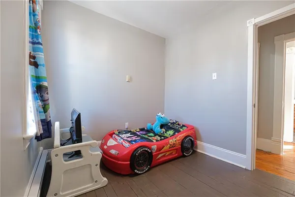 a bed room with a bed and a window