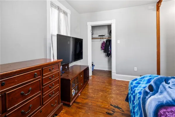 a living room with furniture and flat screen tv