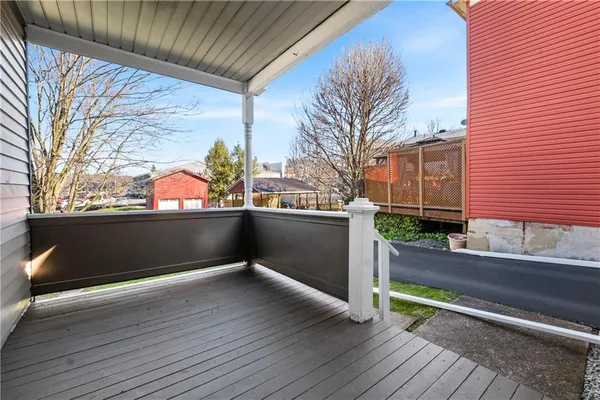 a view of a balcony with a bench