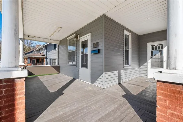 a view of a house with wooden floor and furniture