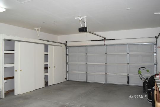 919 Sims Street Ridgecrest, CA 93555 - Photo 31 of 32 a view of a storage & utility room with racks on the wall