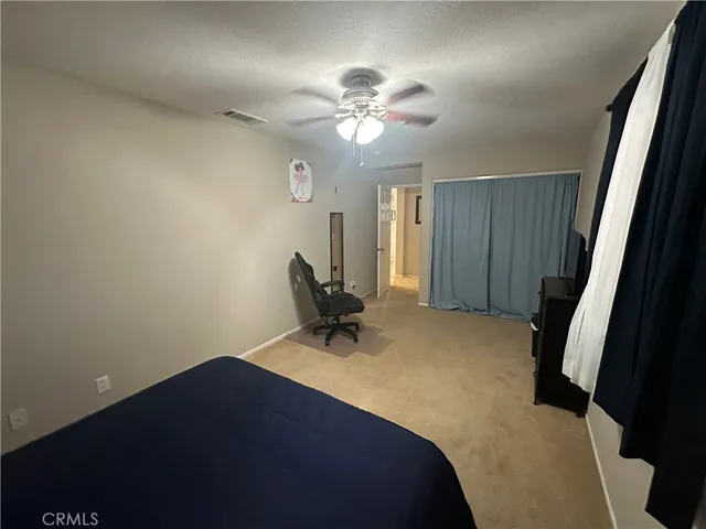 a view of a hallway with wooden floor and entryway