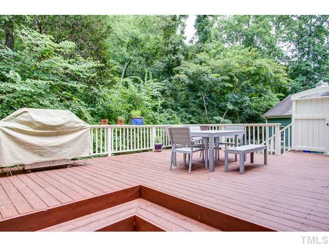 239 Stable Road Carrboro, NC 27510 - Photo 16 of 25 The generously sized 17' x 25' DECK overlooks the OWASA woodlands for additional privacy.