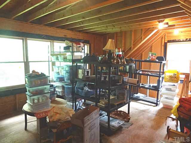 239 Stable Road Carrboro, NC 27510 - Photo 19 of 25 The 15 x 16 Unfinished STORAGE AREA ABOVE THE GARAGE is accessed via permanent stairs.