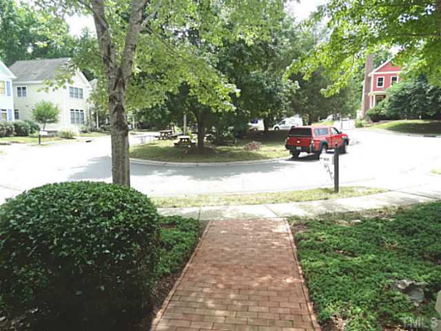 239 Stable Road Carrboro, NC 27510 - Photo 22 of 25 From the 239 Stable's front stoop, one can view the community cul-de-sac. Picnic tables, children's toys, and even a fire ring are stationed on the lawn.
