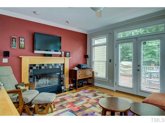 239 Stable Road Carrboro, NC 27510 - Photo 4 of 25 The bright and beautiful FAMILY ROOM features wood burning fireplace. French doors lead to the deck area.