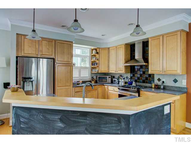 239 Stable Road Carrboro, NC 27510 - Photo 5 of 25 Efficient 11' x 12' KITCHEN has hardwood floors.