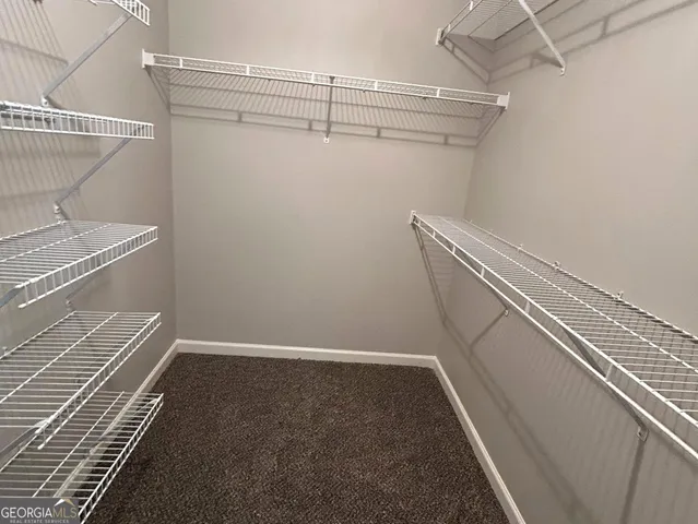 a view of a room with racks on the wall