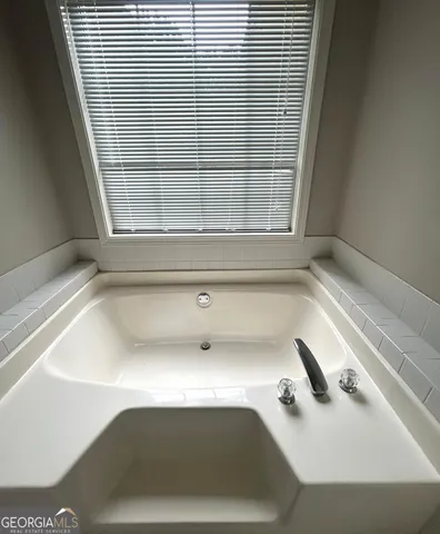 a bathroom with a sink and a bathtub
