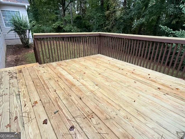 a view of balcony and wooden floor