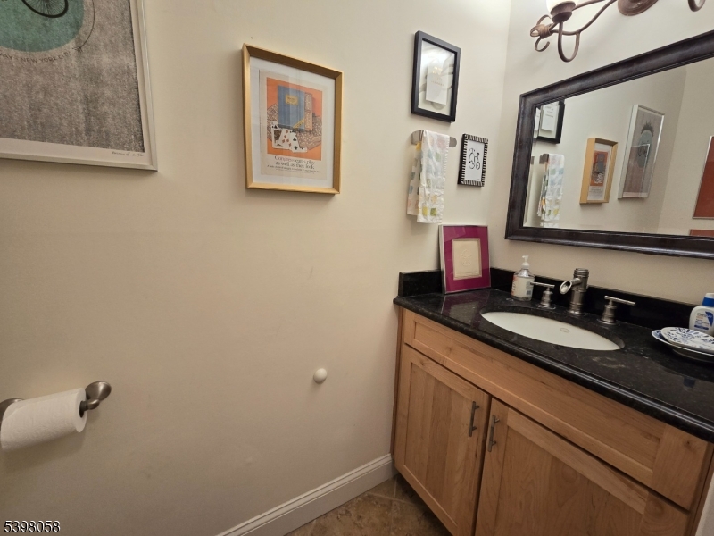 87 East Main Street, Unit 87B Mendham, NJ 07945 - Photo 12 of 27 a bathroom with a sink and a mirror