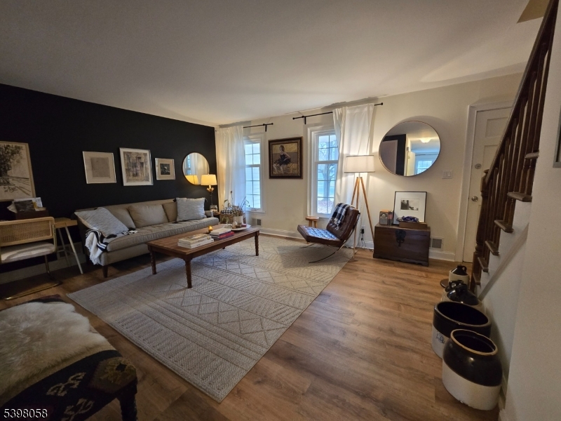 87 East Main Street, Unit 87B Mendham, NJ 07945 - Photo 14 of 27 a living room with furniture and a flat screen tv