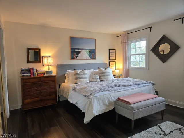 a bedroom with a bed and a tv