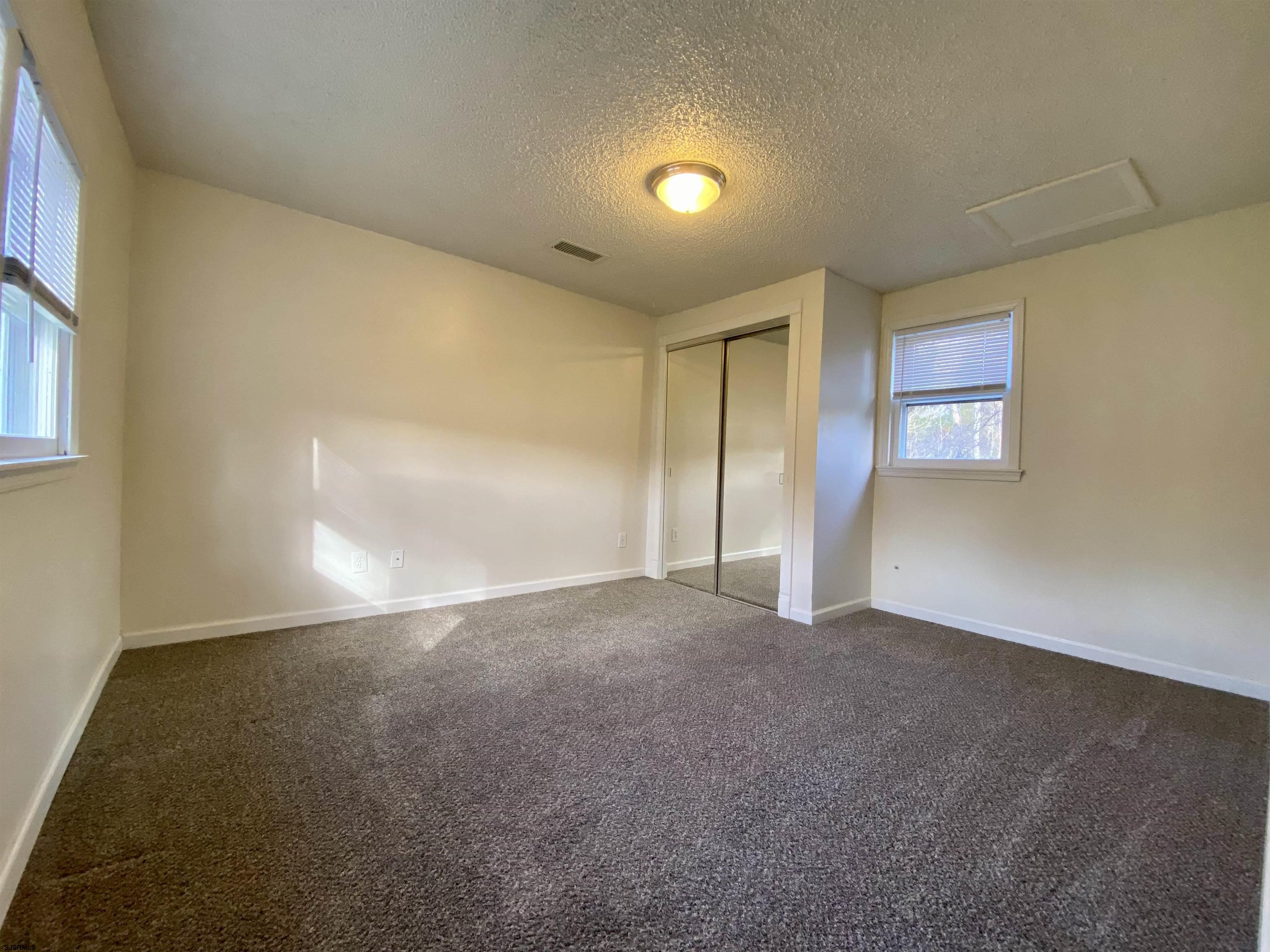 201 Broad Street Milmay, NJ 08340 - Photo 13 of 23 an empty room with windows