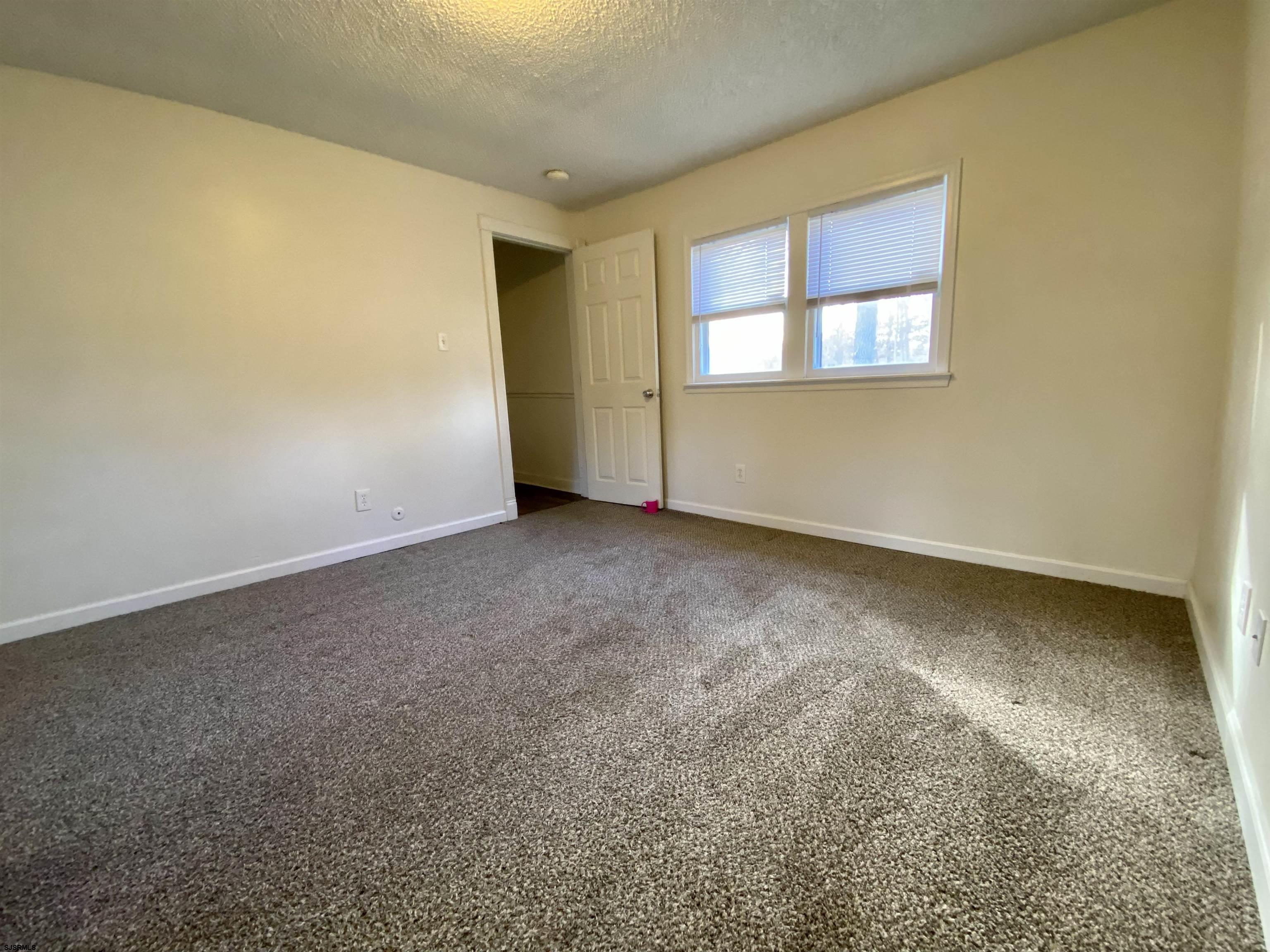201 Broad Street Milmay, NJ 08340 - Photo 14 of 23 an empty room with a window