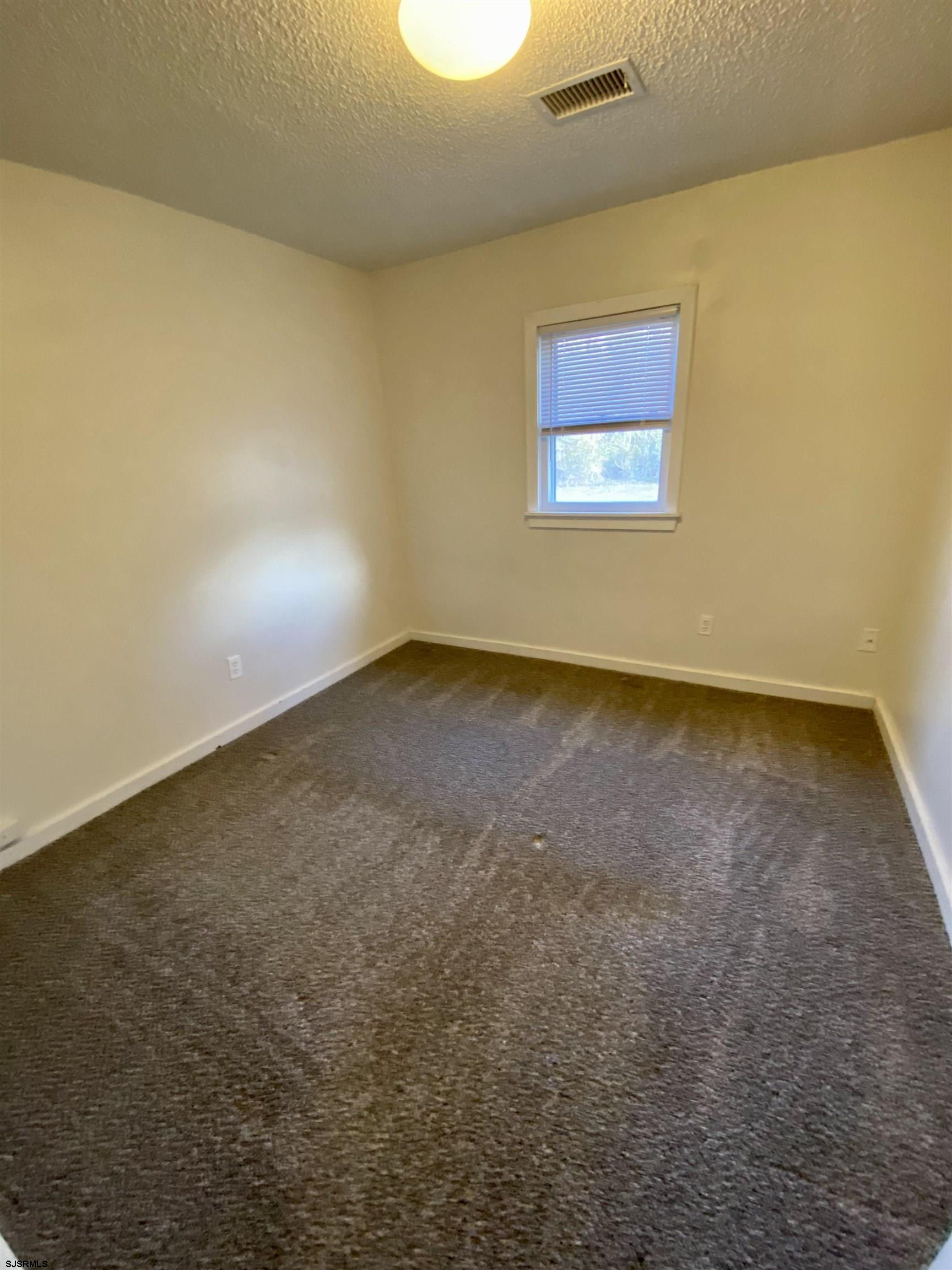 201 Broad Street Milmay, NJ 08340 - Photo 16 of 23 an empty room with a empty space