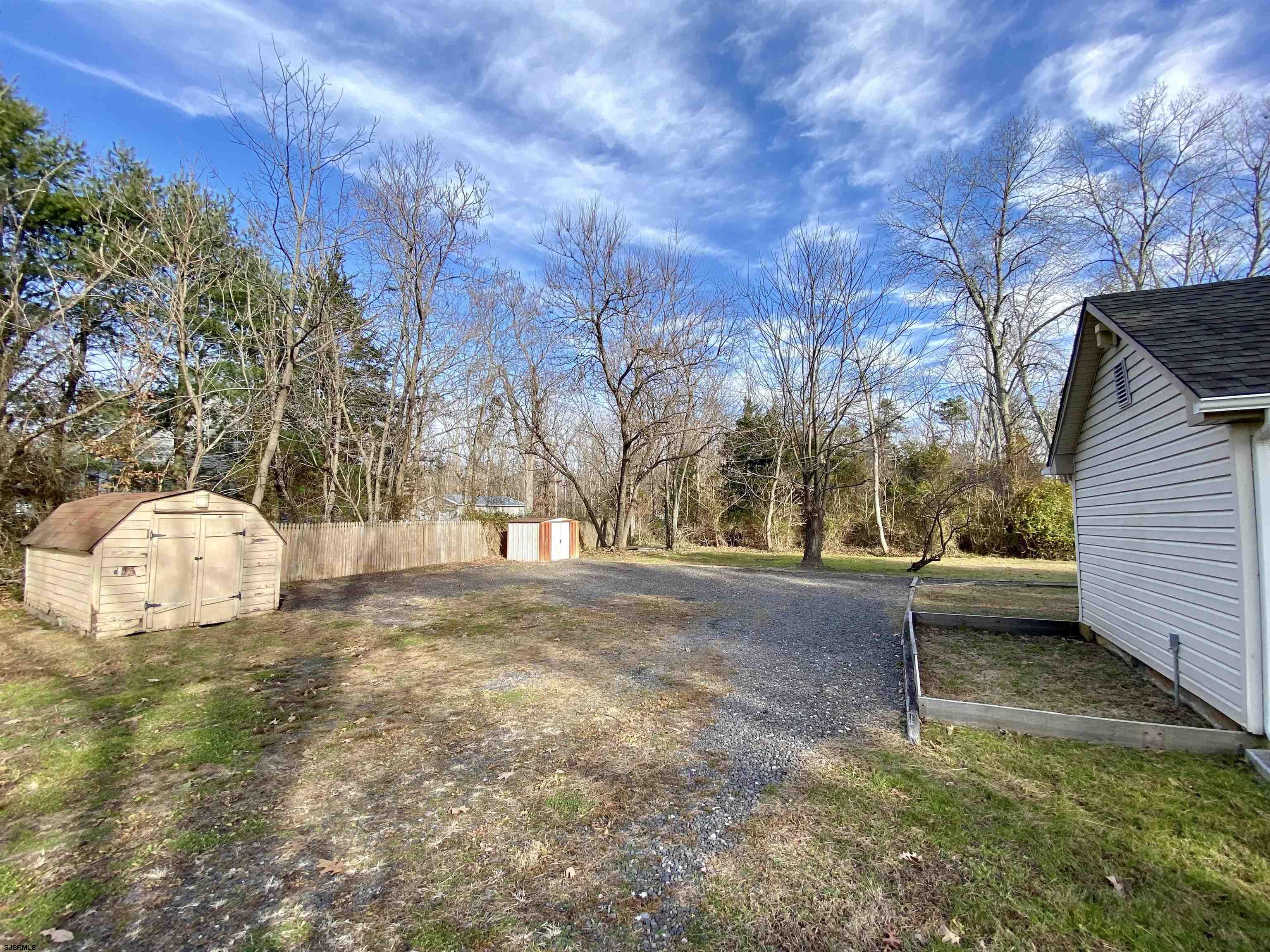 201 Broad Street Milmay, NJ 08340 - Photo 20 of 23 a view of yard with wooden fence