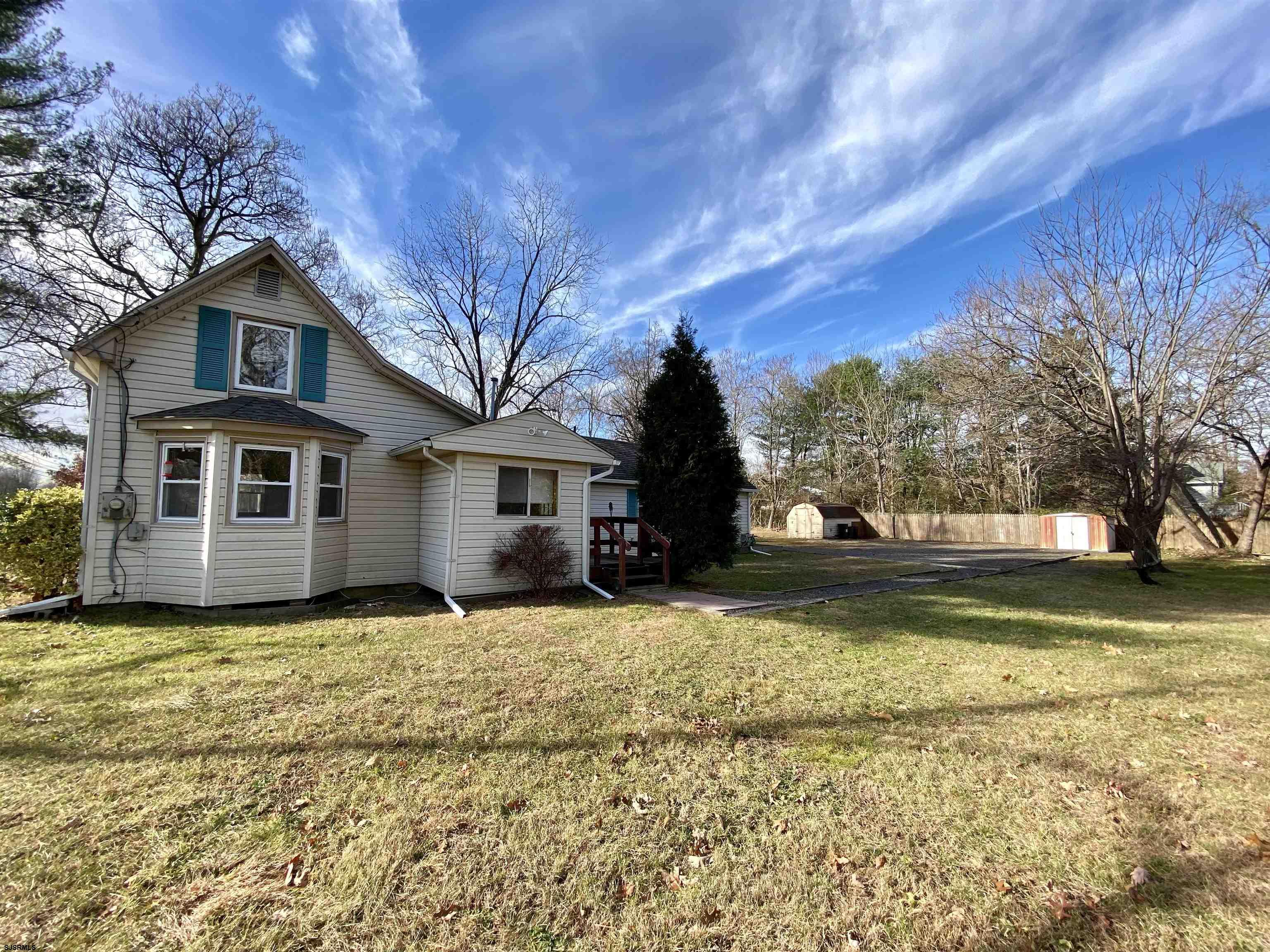 201 Broad Street Milmay, NJ 08340 - Photo 22 of 23 a front view of a house with a yard