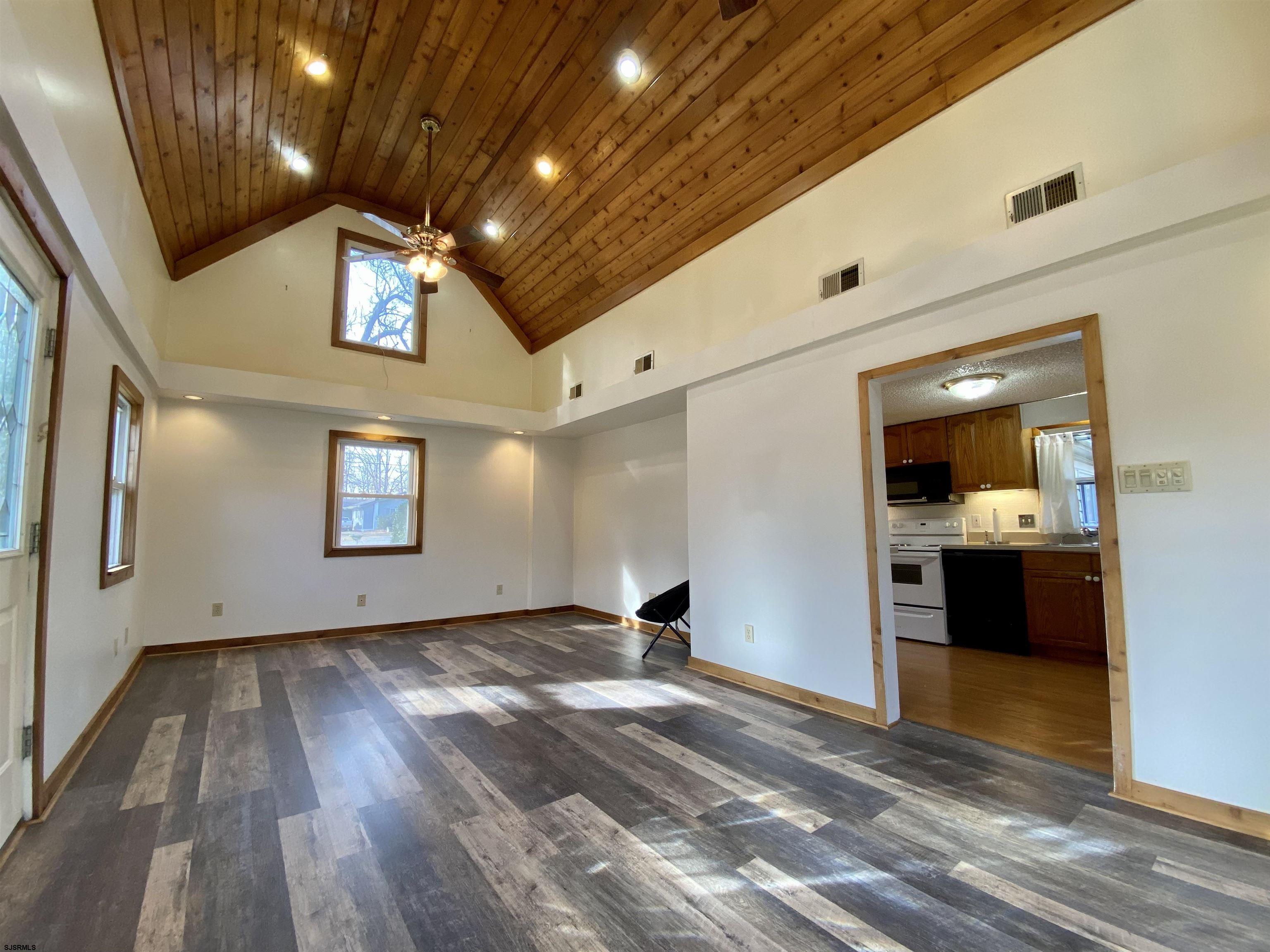 201 Broad Street Milmay, NJ 08340 - Photo 5 of 23 a view of empty room with wooden floor